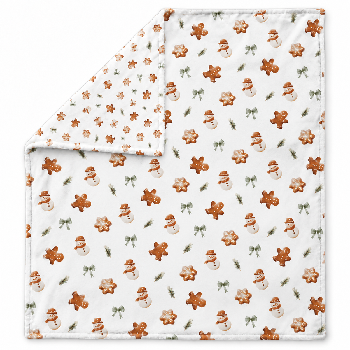 Ausgebreitete Kuscheldecke „Lebkuchenmännchen“ mit umgeschlagener Ecke auf weißem Hintergrund.