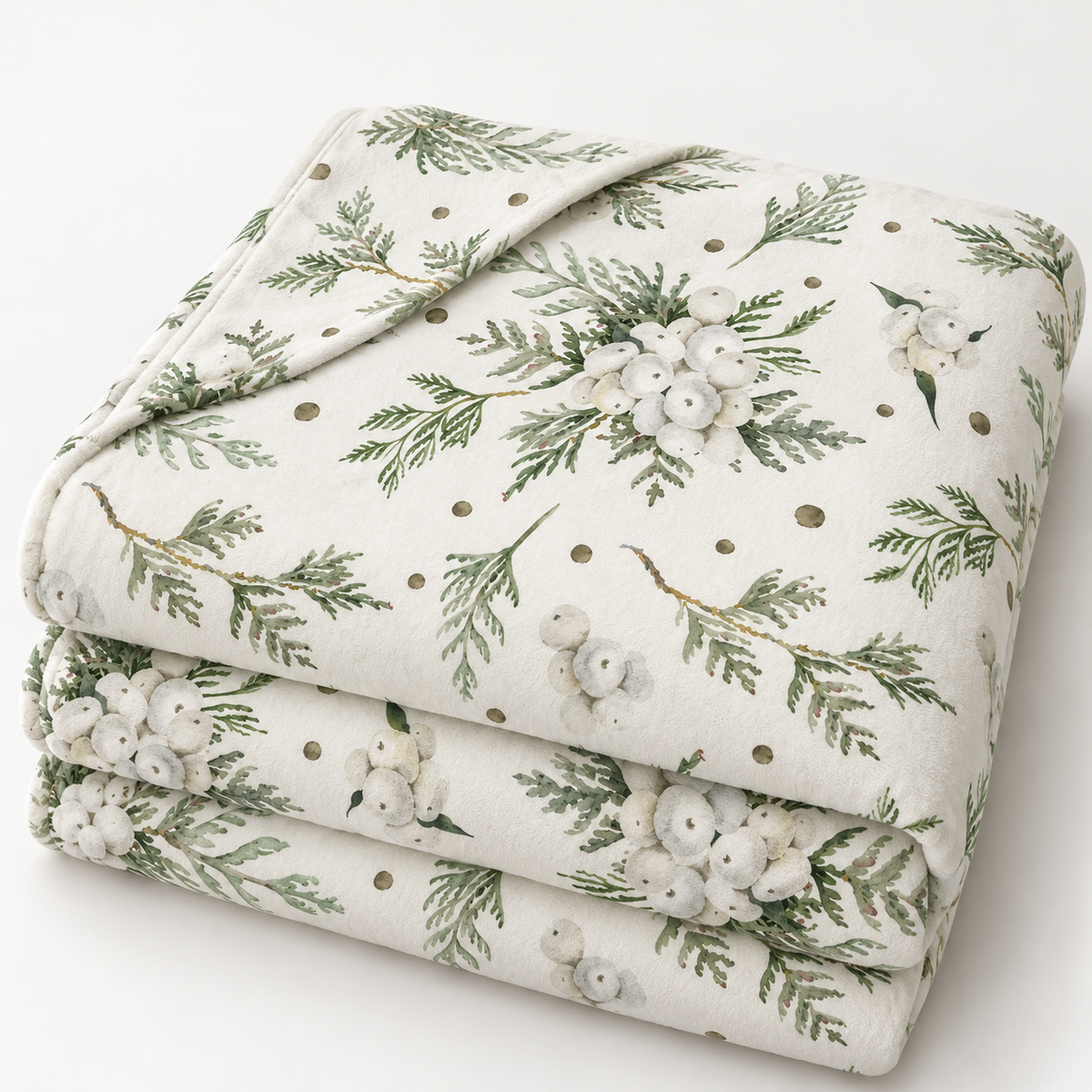Gefaltete Kuscheldecke „Snowberry“ mit umgeschlagener Ecke auf weißem Hintergrund.