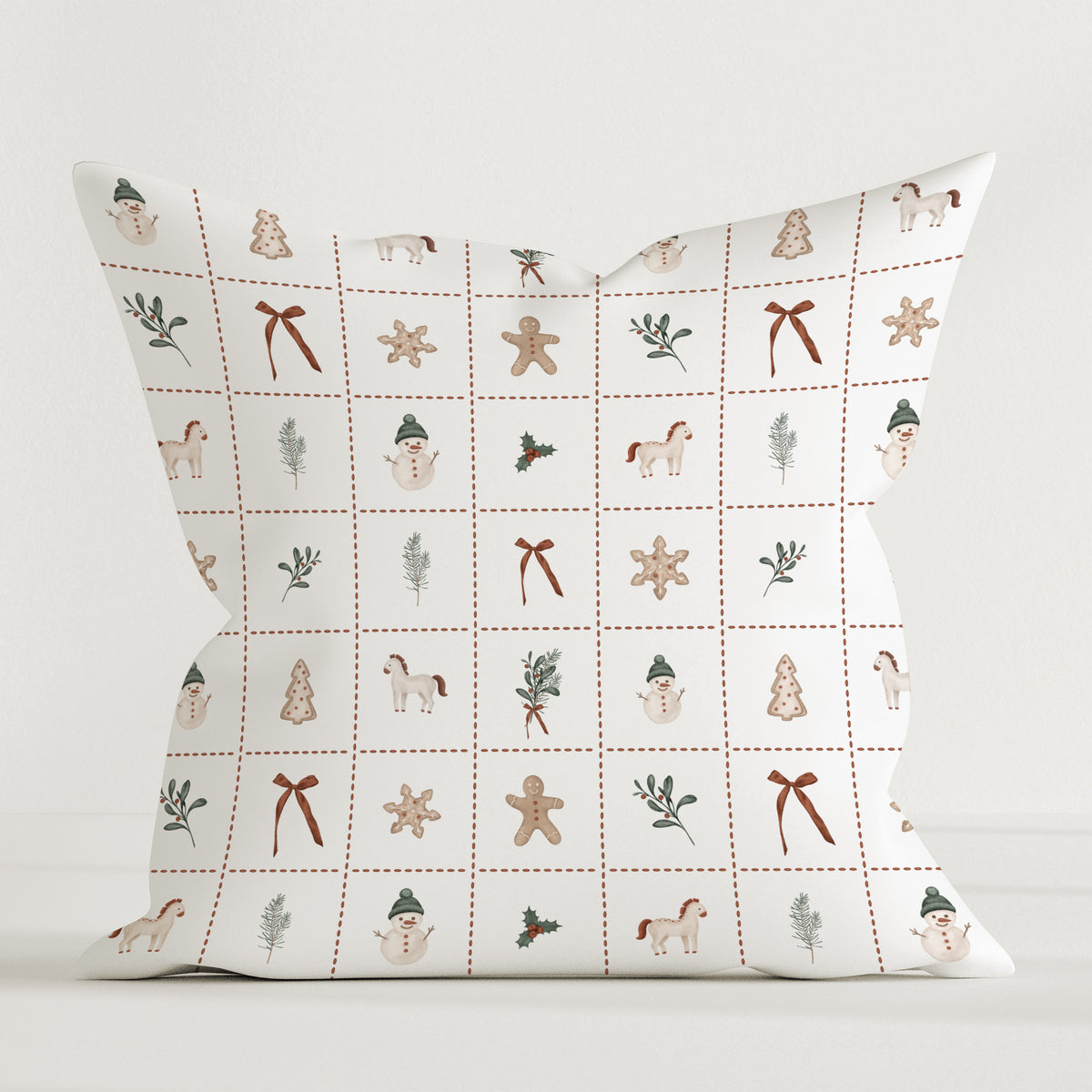 Leslis-Dekokissen „Merry Patch“ mit weihnachtlichen Motiven in einem feinen Karomuster.
