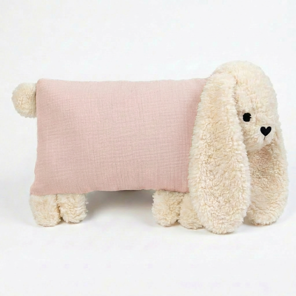 Kuschelhase in zartem Rosa mit weichem Kopf und langen Schlappohren.