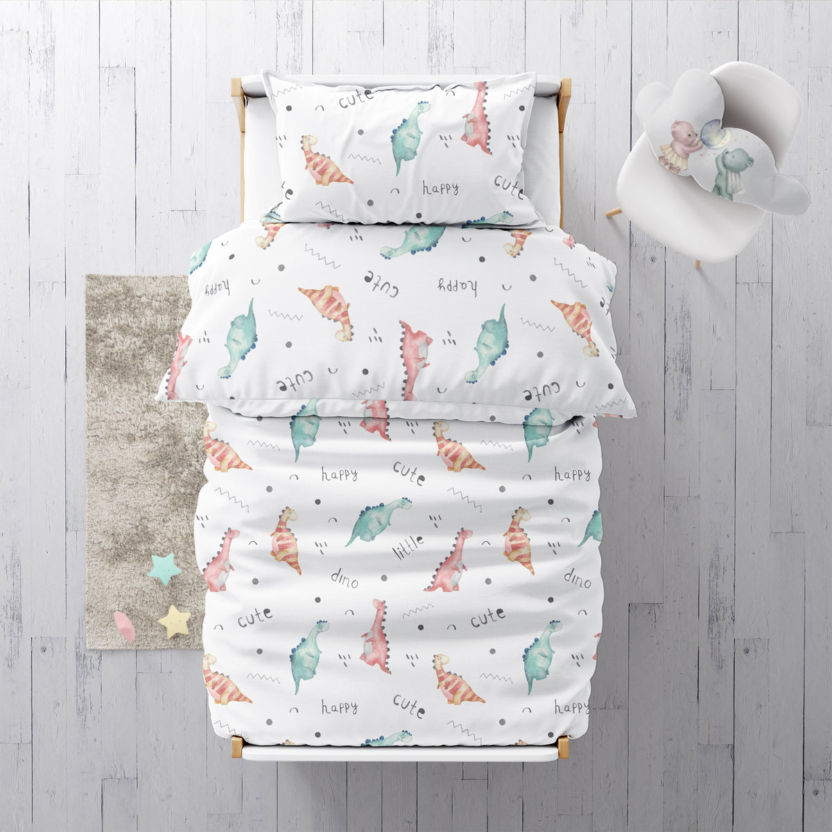 Draufsicht auf ein Bett mit Leslis-Kinderbettwäsche „Little Dino“ und passendem Kissen.