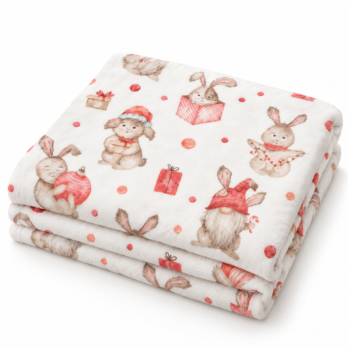 Gefaltete Kuscheldecke „Weihnachtshasen“ mit umgeschlagener Ecke auf weißem Hintergrund.