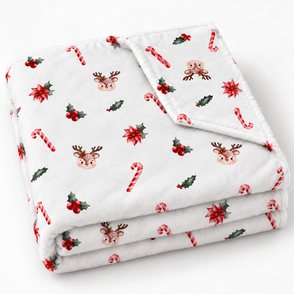 Gefaltete Kuscheldecke „Zuckerstangen und Rehe“ mit umgeschlagener Ecke auf weißem Hintergrund.